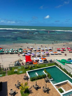 Mirante de Porto Flat de luxo pé na areia em frente às piscinas naturais de Porto de Galinhas